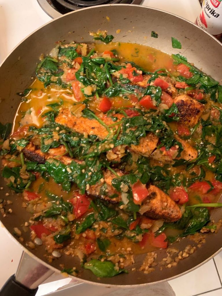 TUSCAN GARLIC SALMON SKILLET WITH SPINACH AND TOMATO